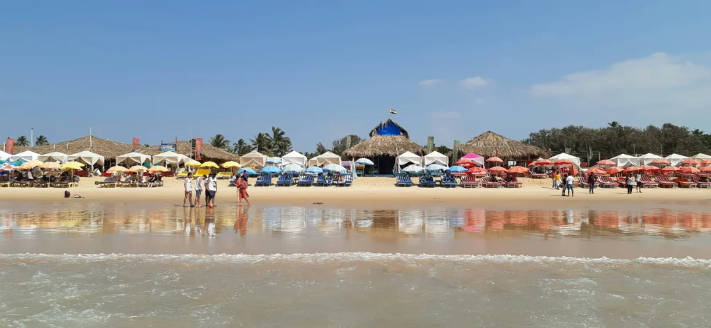 Top 10 places to visit in Goa - Thriving crowds and beach umbrellas on the sand at Calangute